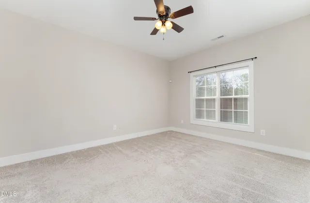 a view of a house with a yard and garage