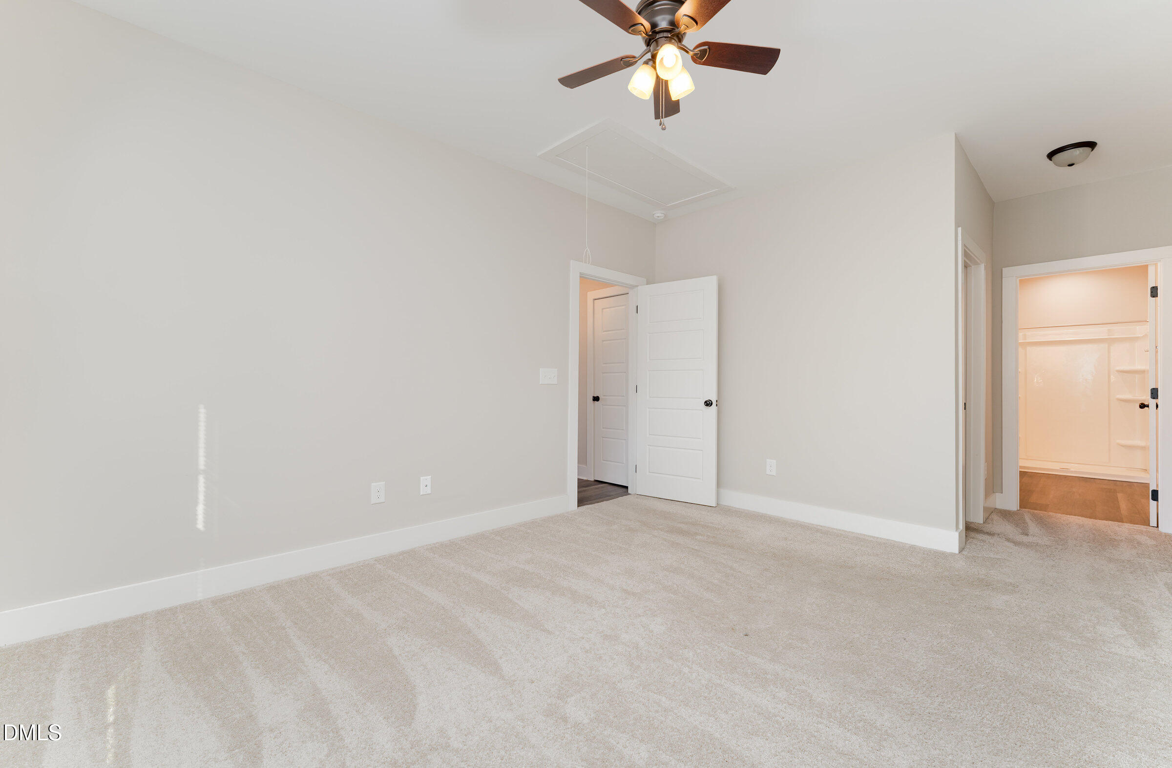 903 West Anderson Street, Unit 1/2 Selma, NC 27576 - Photo 22 of 36 an empty room with a chandelier fan