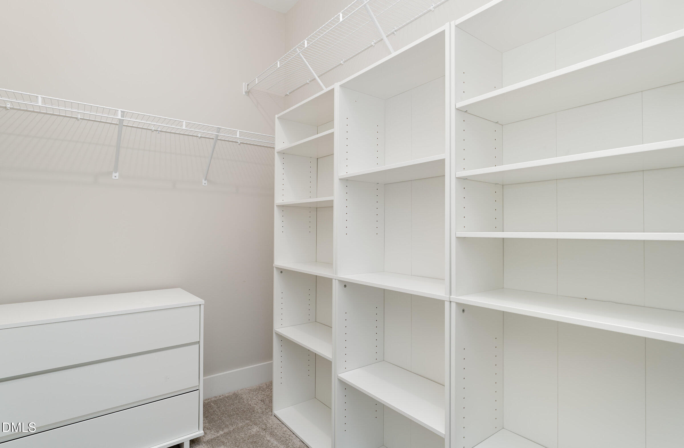 903 West Anderson Street, Unit 1/2 Selma, NC 27576 - Photo 24 of 36 a view of walk in closet with empty racks