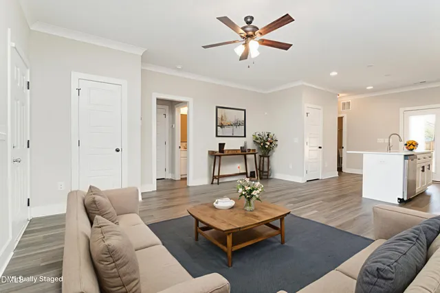 a kitchen with stainless steel appliances a refrigerator stove microwave and sink