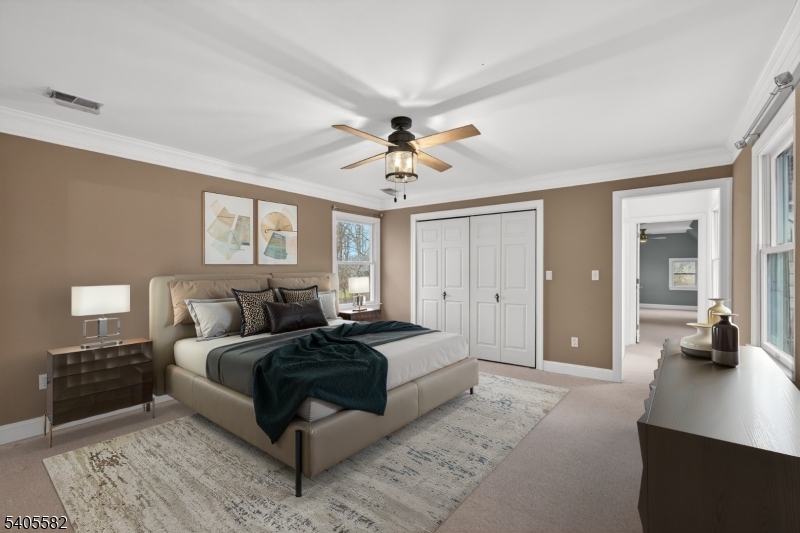 101 Parker Road Bloomsbury, NJ 08804 - Photo 12 of 29 a bedroom with a bed and a chandelier