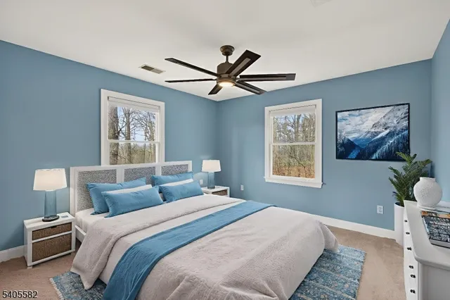 a bedroom with a large bed and a window