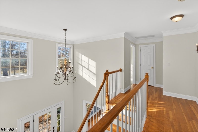 101 Parker Road Bloomsbury, NJ 08804 - Photo 24 of 29 a view of a livingroom with wooden floor and stairs