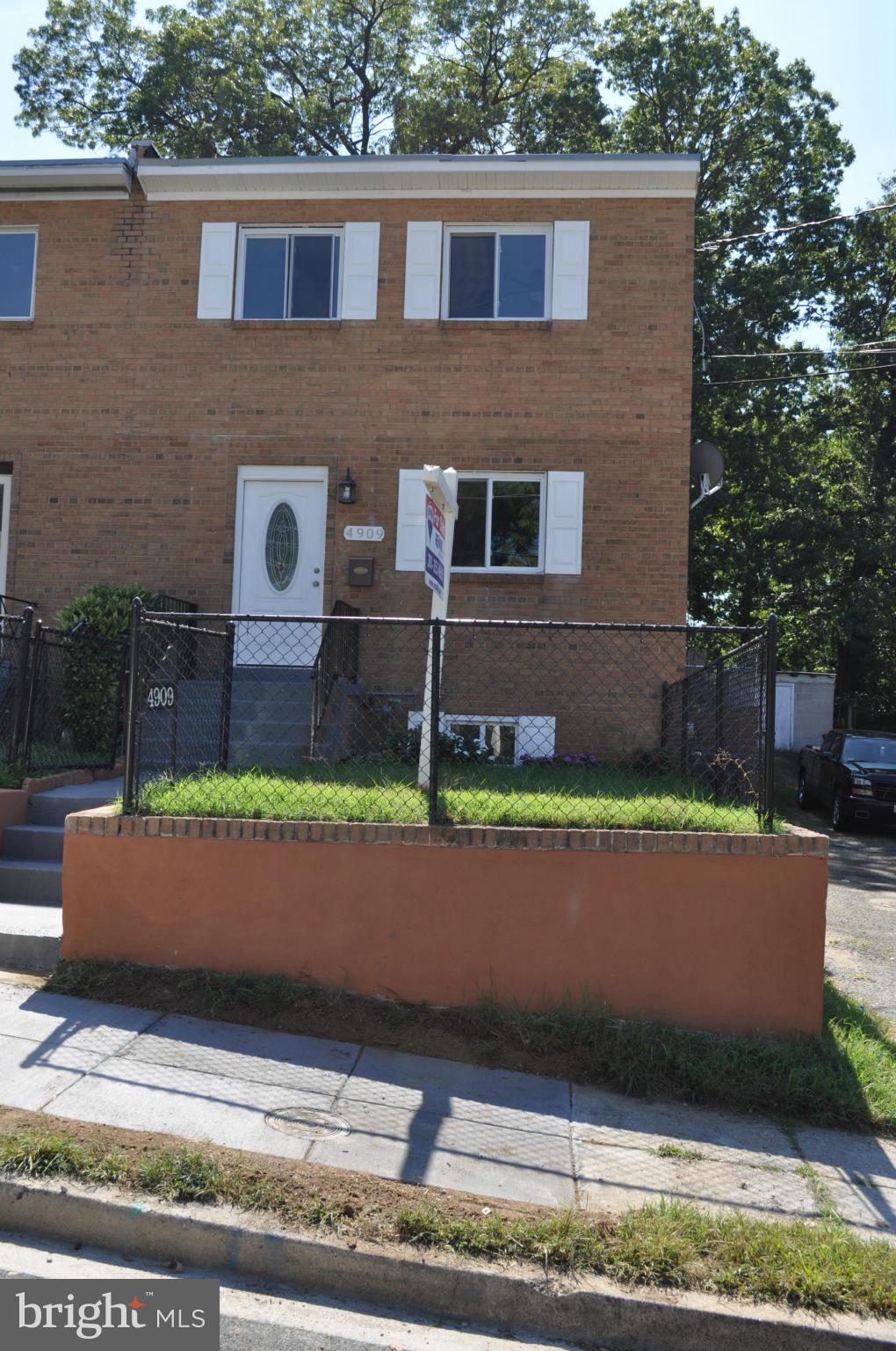 4909 Fitch Place Northeast Washington, DC 20019 - Photo 1 of 30 a house view with a garden space