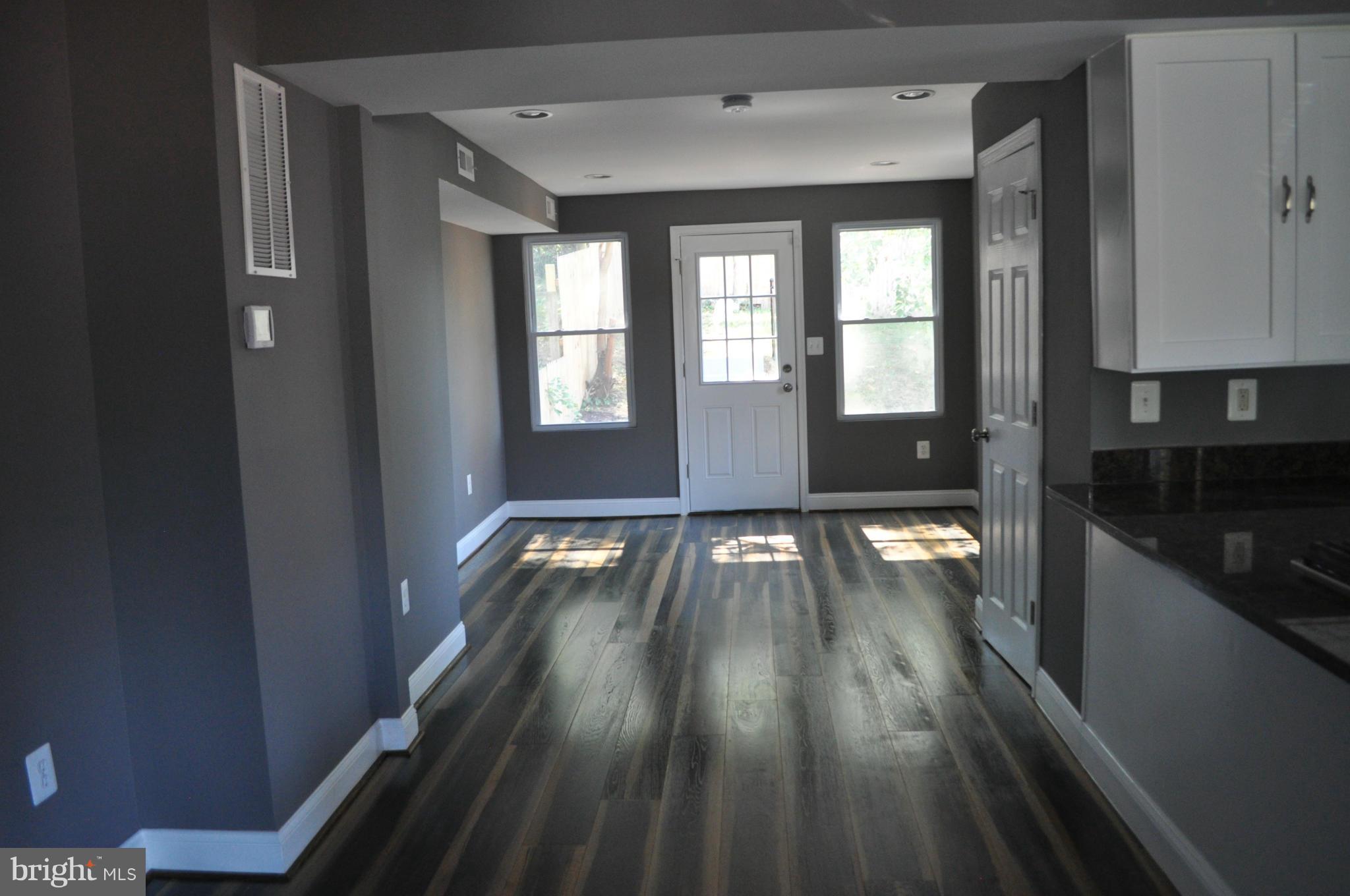 4909 Fitch Place Northeast Washington, DC 20019 - Photo 12 of 30 a view of empty room with wooden floor and fan