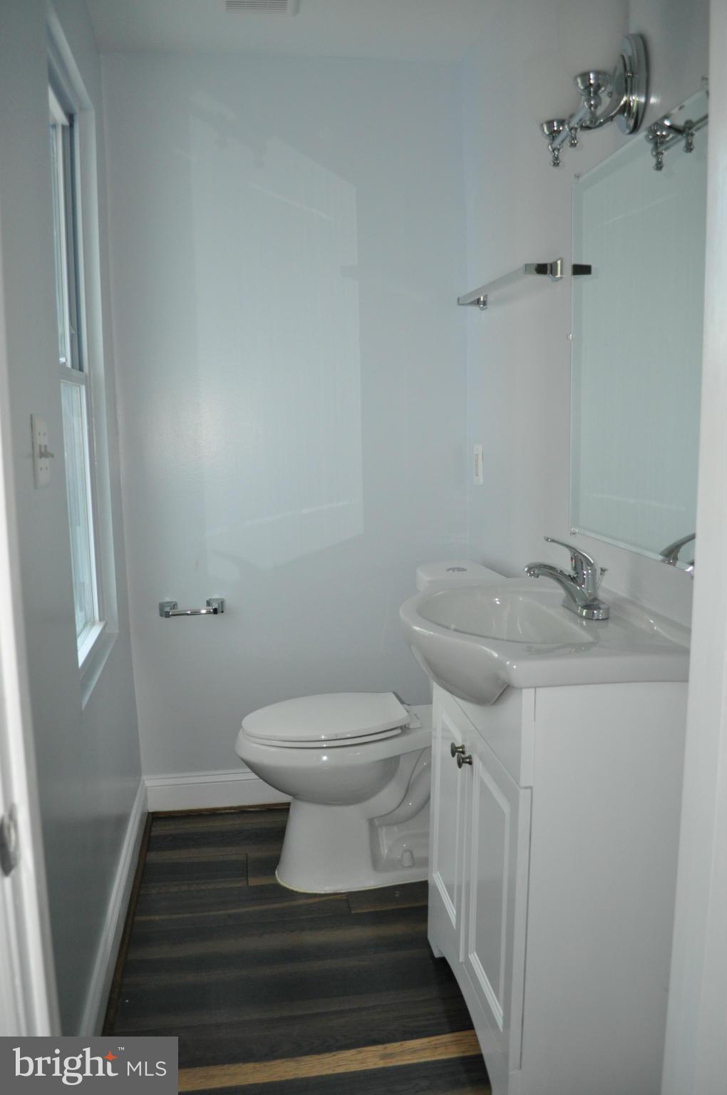4909 Fitch Place Northeast Washington, DC 20019 - Photo 17 of 30 a bathroom with a sink and a toilet