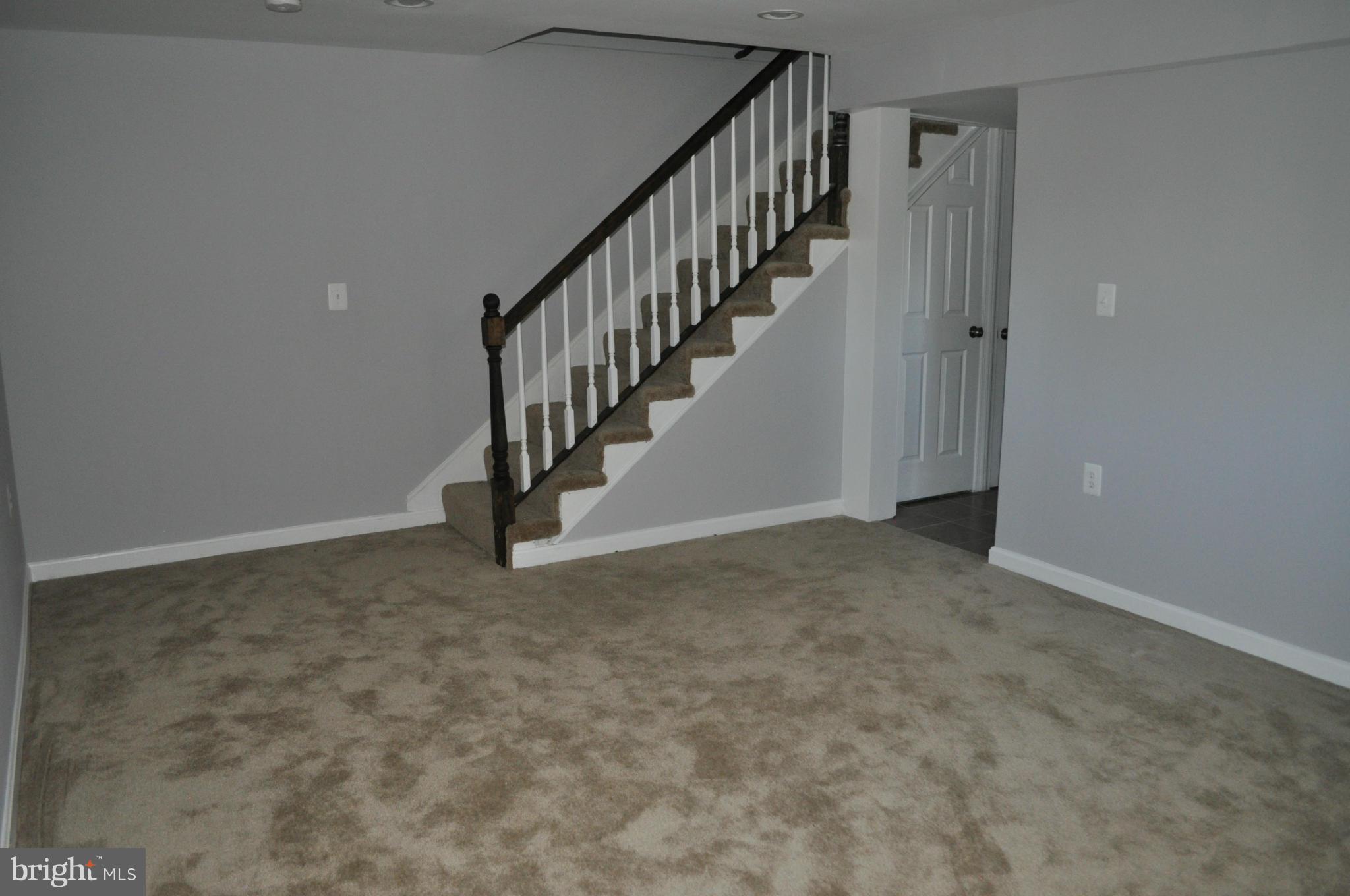 4909 Fitch Place Northeast Washington, DC 20019 - Photo 28 of 30 a view of an empty room with stairs