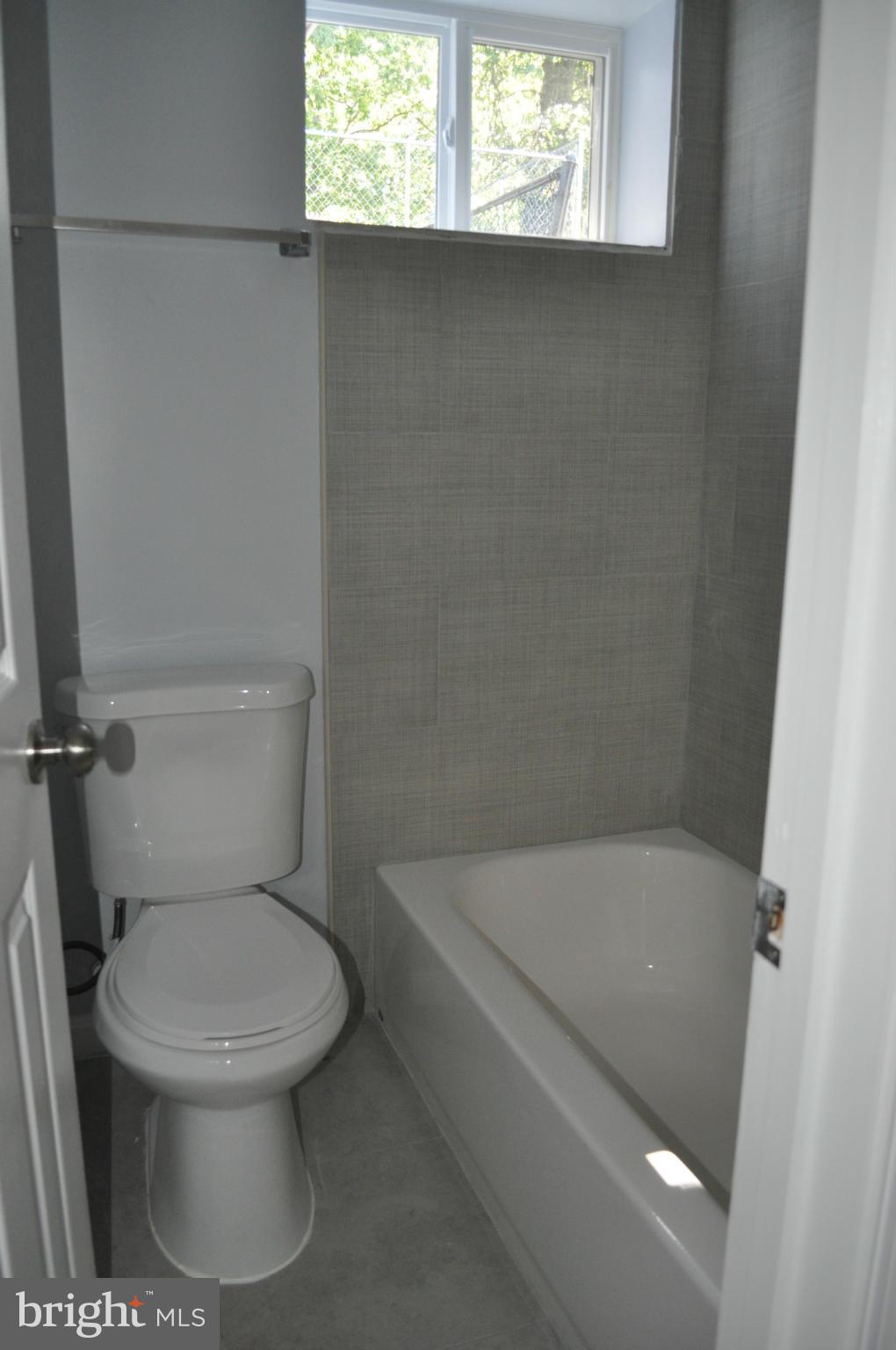 4909 Fitch Place Northeast Washington, DC 20019 - Photo 30 of 30 a white toilet sitting next to a bath tub