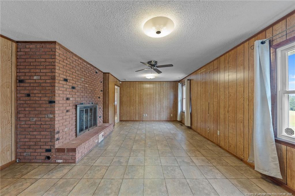 241 Hight Road Aberdeen, NC 28315 - Photo 14 of 48 a view of a hallway with brick walls