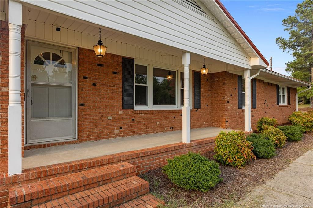 241 Hight Road Aberdeen, NC 28315 - Photo 2 of 48 a front view of a house with a yard