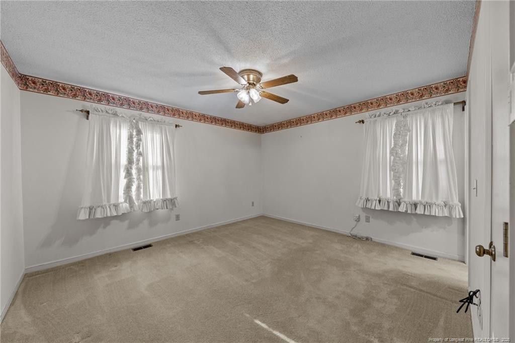 241 Hight Road Aberdeen, NC 28315 - Photo 21 of 48 a view of an empty room with a window