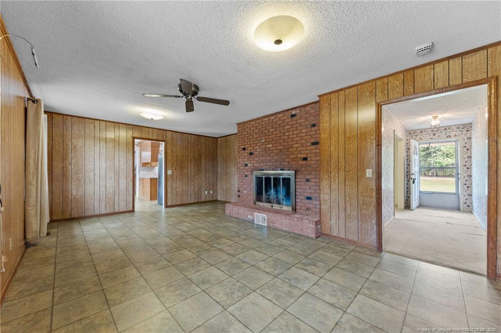 241 Hight Road Aberdeen, NC 28315 - Photo 24 of 48 a view of a hallway with a fireplace and a window