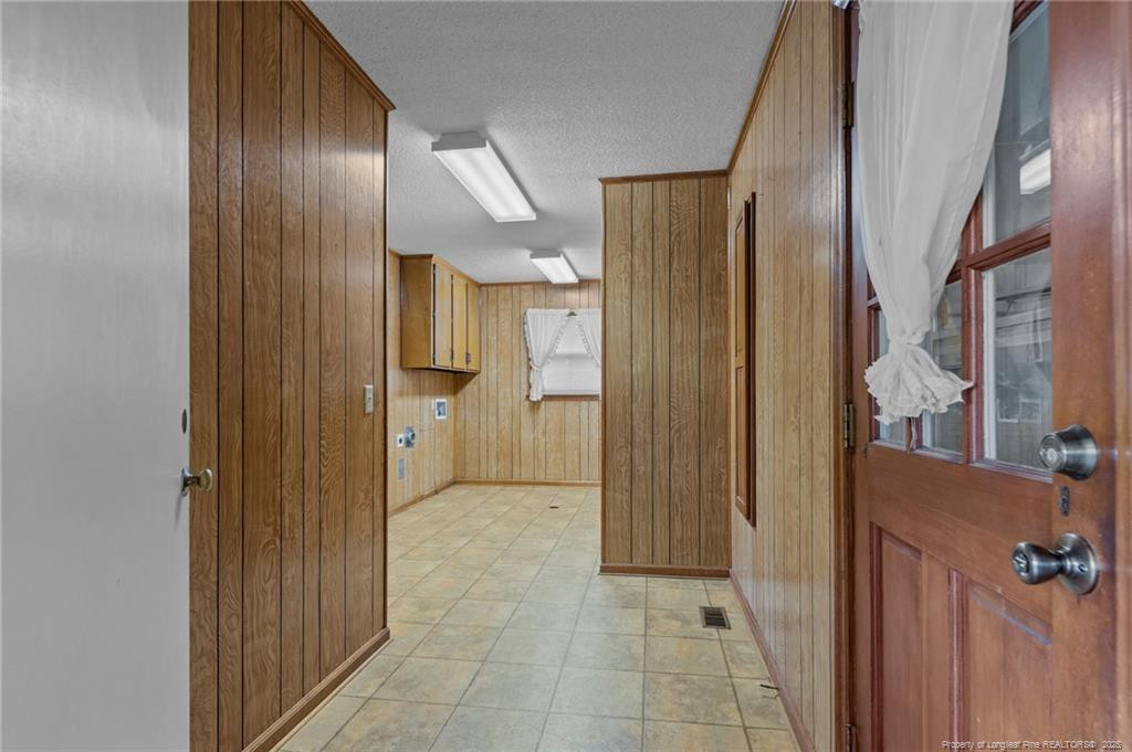 241 Hight Road Aberdeen, NC 28315 - Photo 25 of 48 a view of a hallway with wooden shelves