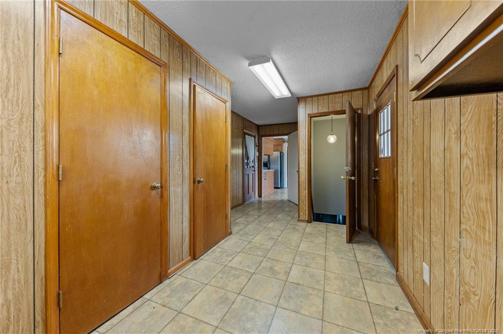 241 Hight Road Aberdeen, NC 28315 - Photo 26 of 48 a view of hallway with a bathroom and a shower