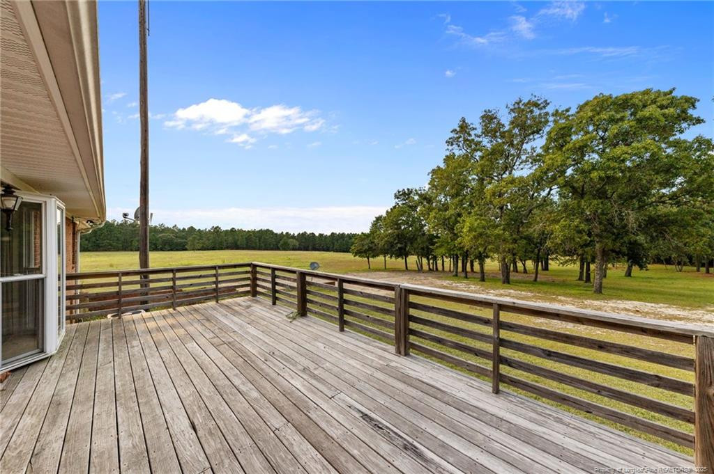 241 Hight Road Aberdeen, NC 28315 - Photo 41 of 48 a view of outdoor space with garden and lots of trees