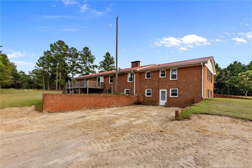 241 Hight Road Aberdeen, NC 28315 - Photo 43 of 48 a front view of a house with a yard