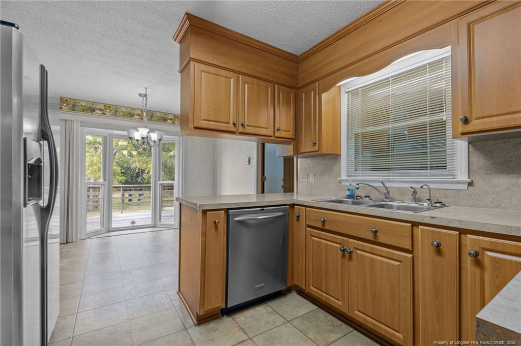 241 Hight Road Aberdeen, NC 28315 - Photo 8 of 48 a kitchen with a sink cabinets and appliances
