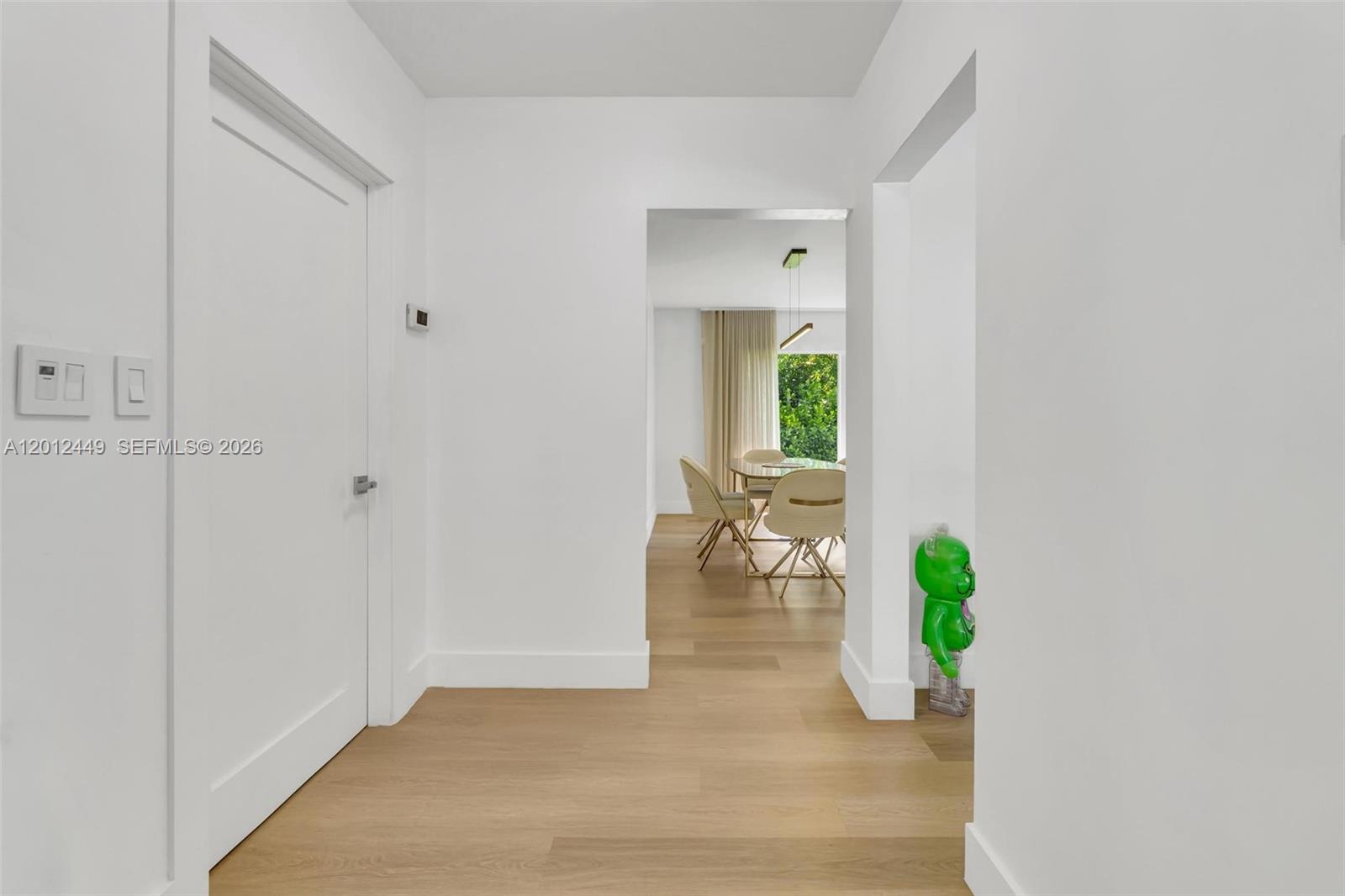 6200 Southwest 118th Street Pinecrest, FL 33156 - Photo 11 of 69 a hallway with table and chairs