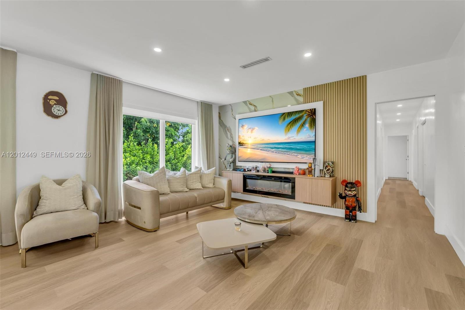 6200 Southwest 118th Street Pinecrest, FL 33156 - Photo 17 of 69 a living room with furniture and a flat screen tv