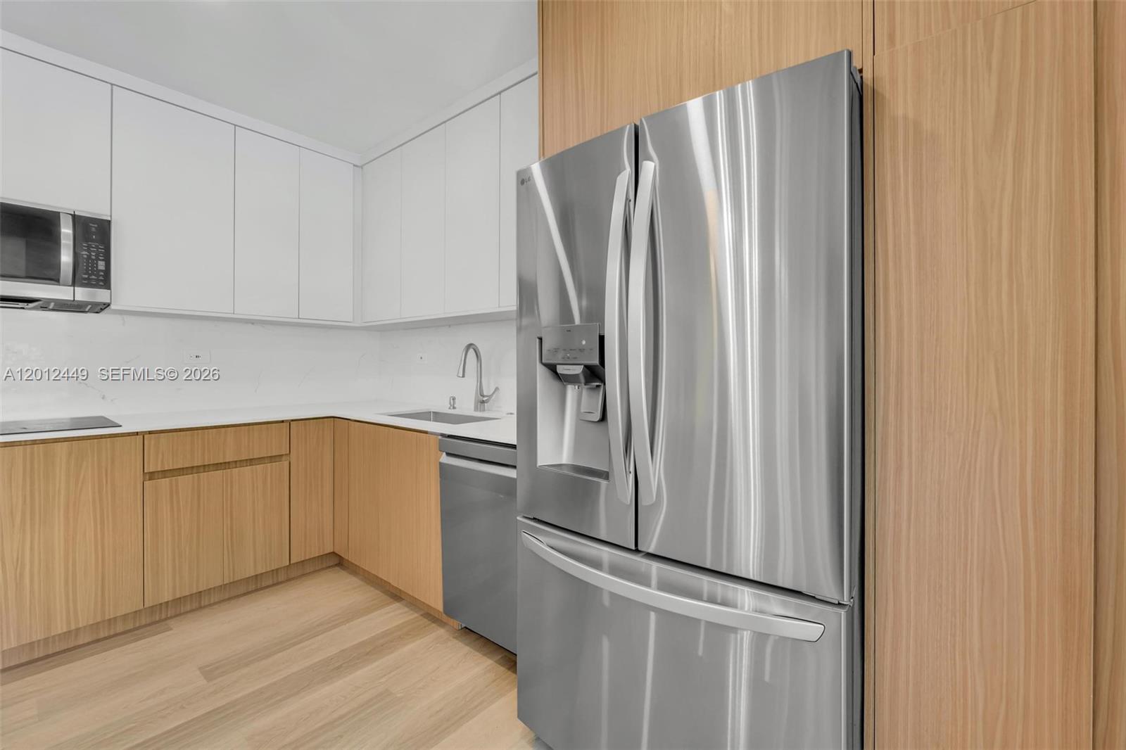 6200 Southwest 118th Street Pinecrest, FL 33156 - Photo 23 of 69 a kitchen with stainless steel appliances granite countertop a refrigerator and a sink