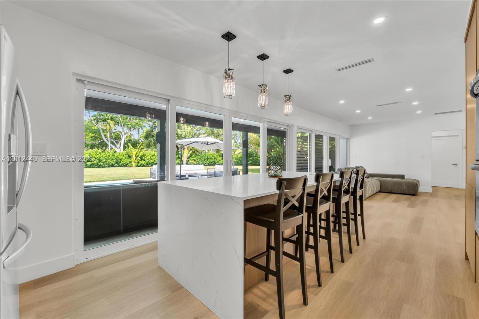 6200 Southwest 118th Street Pinecrest, FL 33156 - Photo 24 of 69 a dining room with furniture window and wooden floor