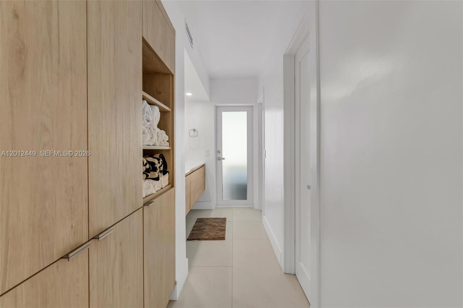 6200 Southwest 118th Street Pinecrest, FL 33156 - Photo 45 of 69 a view of a hallway with wooden floor and staircase