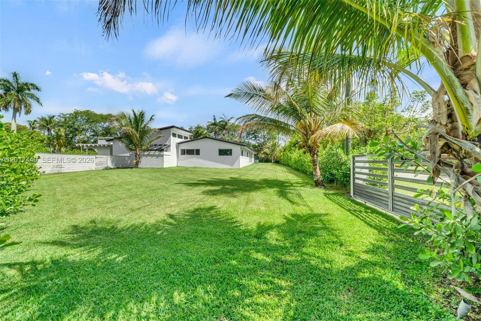 6200 Southwest 118th Street Pinecrest, FL 33156 - Photo 58 of 69 a view of a backyard with a garden
