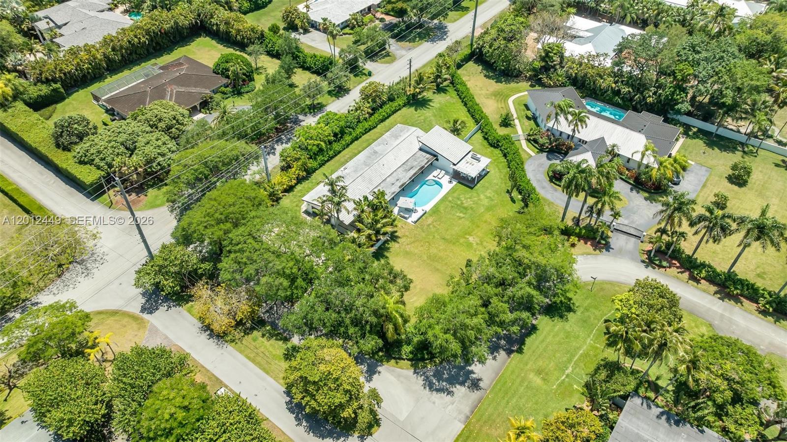 6200 Southwest 118th Street Pinecrest, FL 33156 - Photo 60 of 69 an aerial view of residential houses with outdoor space and trees
