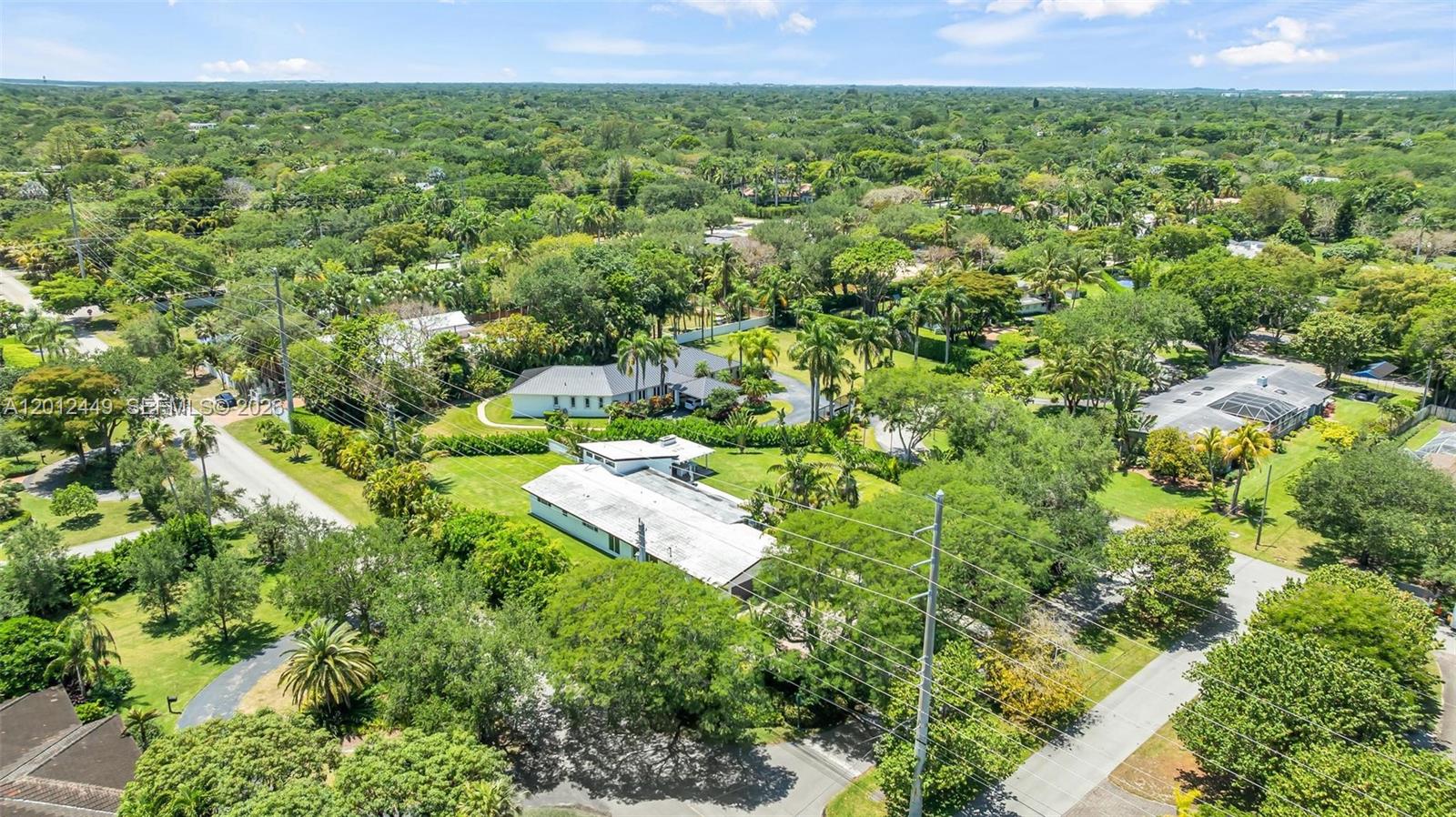 6200 Southwest 118th Street Pinecrest, FL 33156 - Photo 66 of 69 a view of a yard with plants and lawn chair