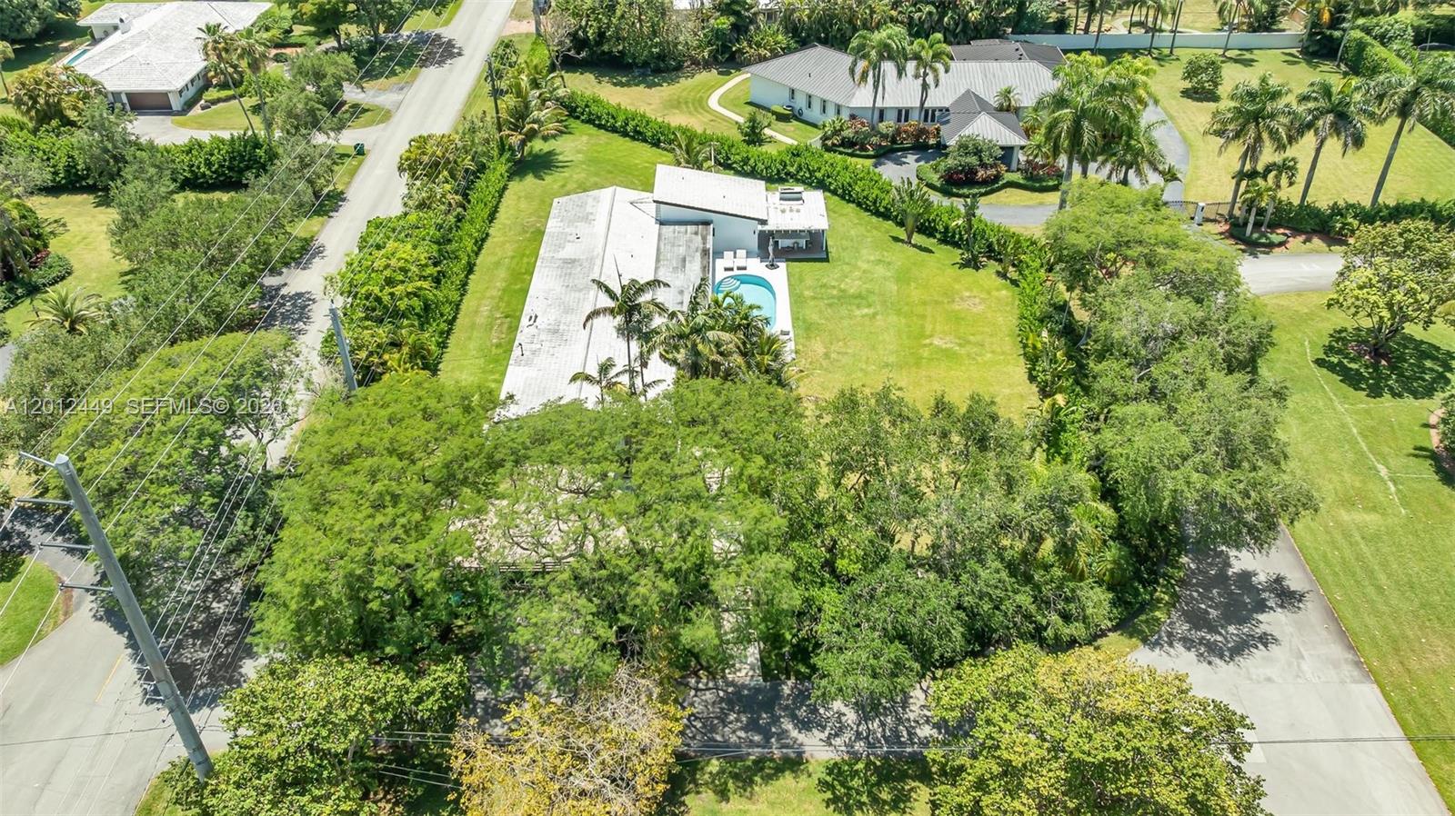 6200 Southwest 118th Street Pinecrest, FL 33156 - Photo 67 of 69 an aerial view of residential house with outdoor space and trees all around