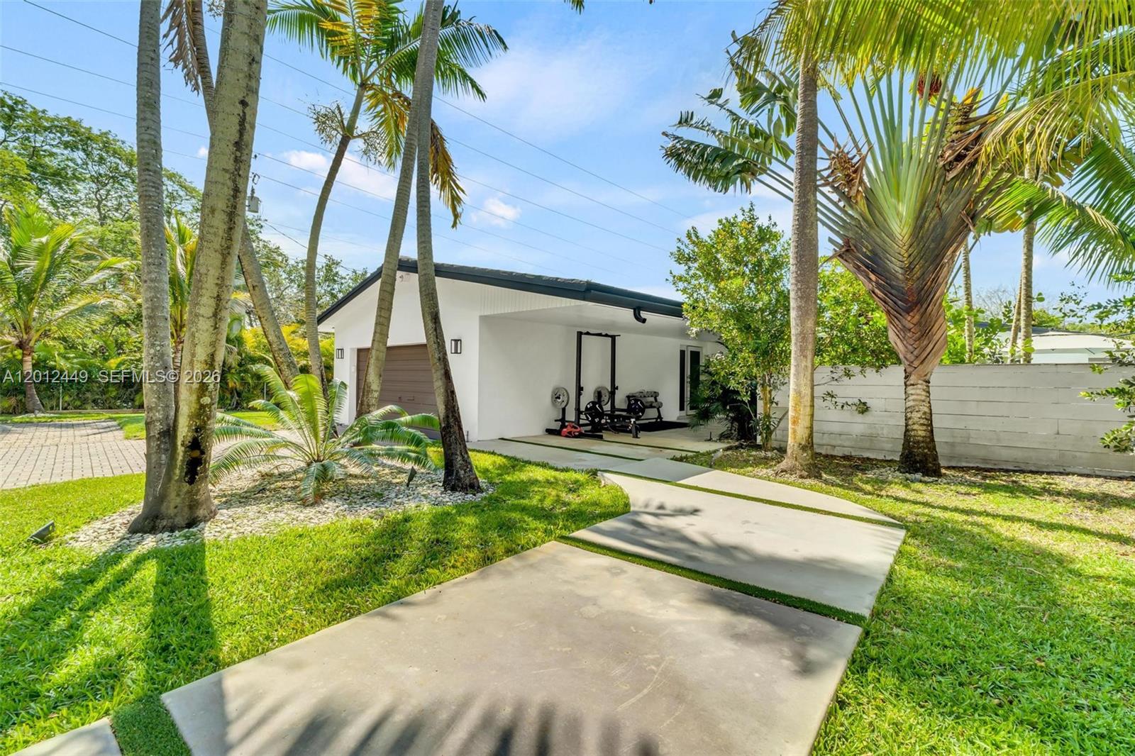 6200 Southwest 118th Street Pinecrest, FL 33156 - Photo 9 of 69 a view of a house with backyard and a tree
