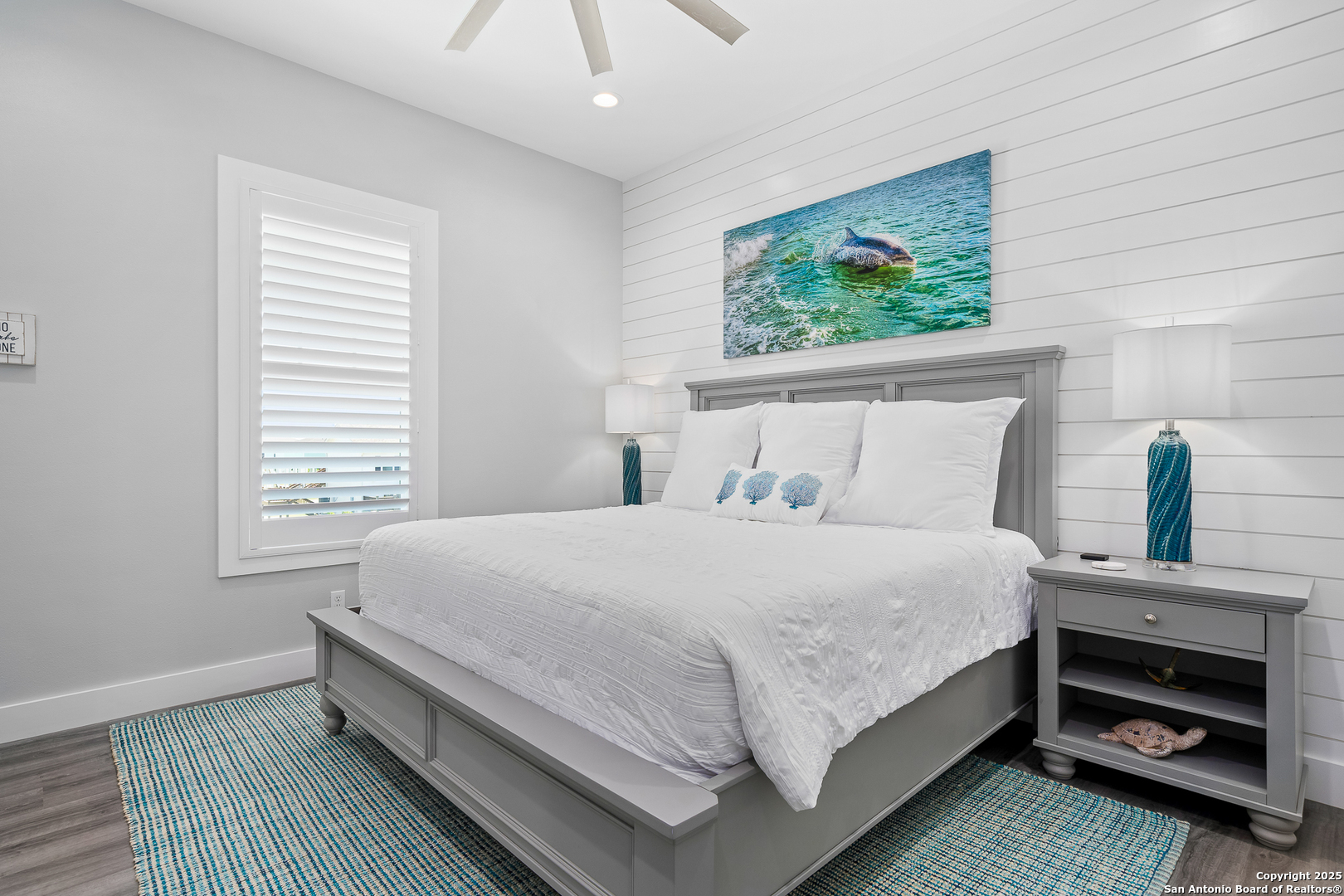 107 Windjammer Road Rockport, TX 78382 - Photo 11 of 52 a bedroom with a bed and a window