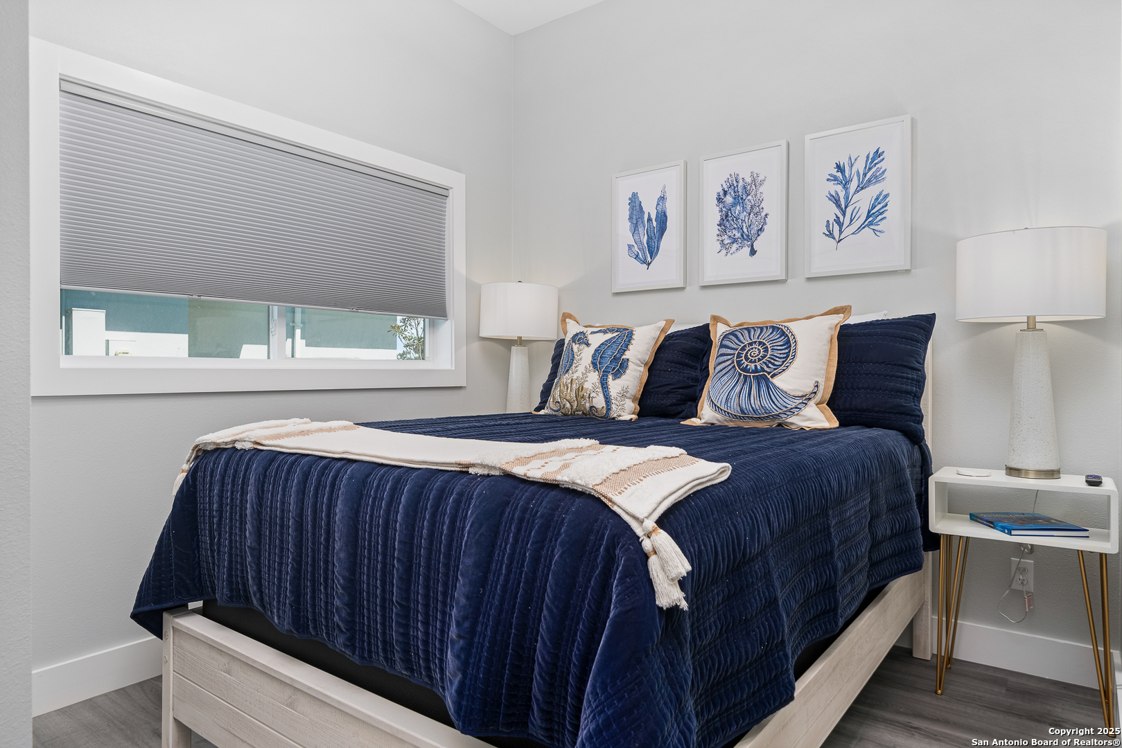 107 Windjammer Road Rockport, TX 78382 - Photo 16 of 52 a bedroom with a bed and a window