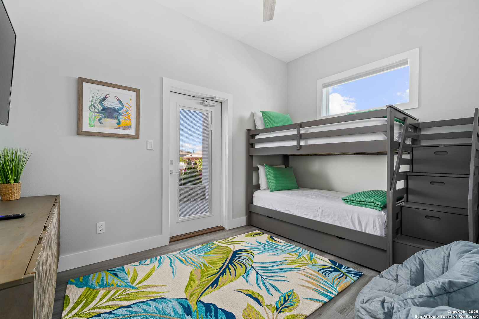 107 Windjammer Road Rockport, TX 78382 - Photo 17 of 52 a bedroom with a bed and a window