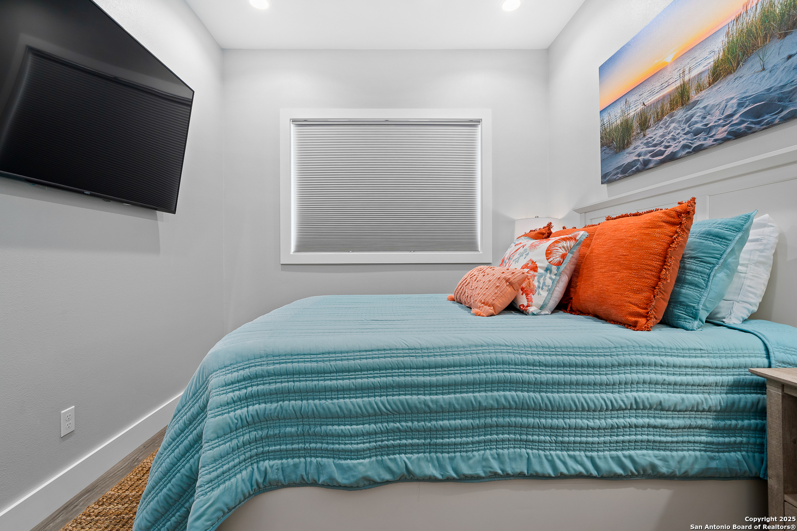 107 Windjammer Road Rockport, TX 78382 - Photo 21 of 52 a bedroom with a bed and a flat screen tv