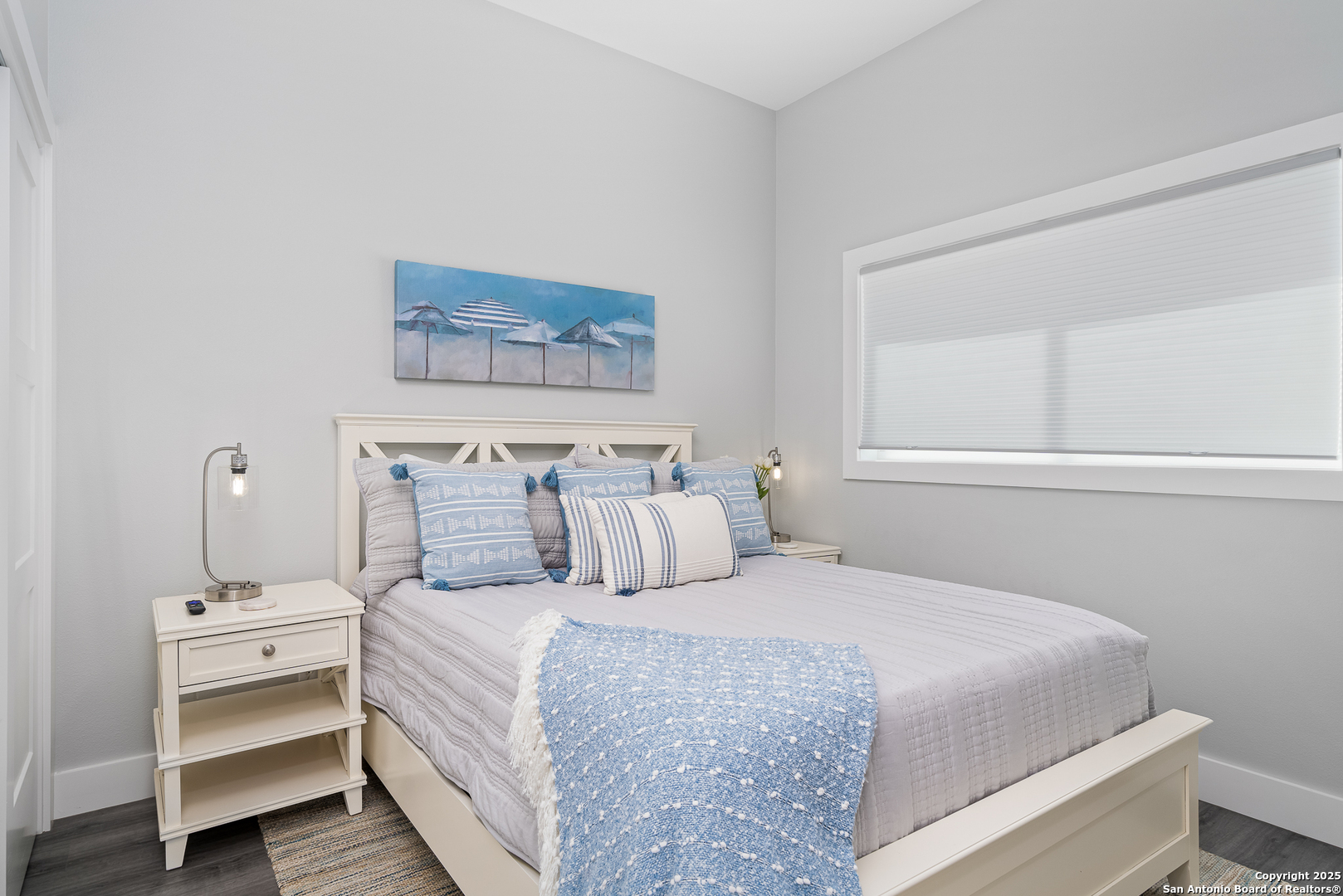 107 Windjammer Road Rockport, TX 78382 - Photo 24 of 52 a bedroom with a bed and a night stand