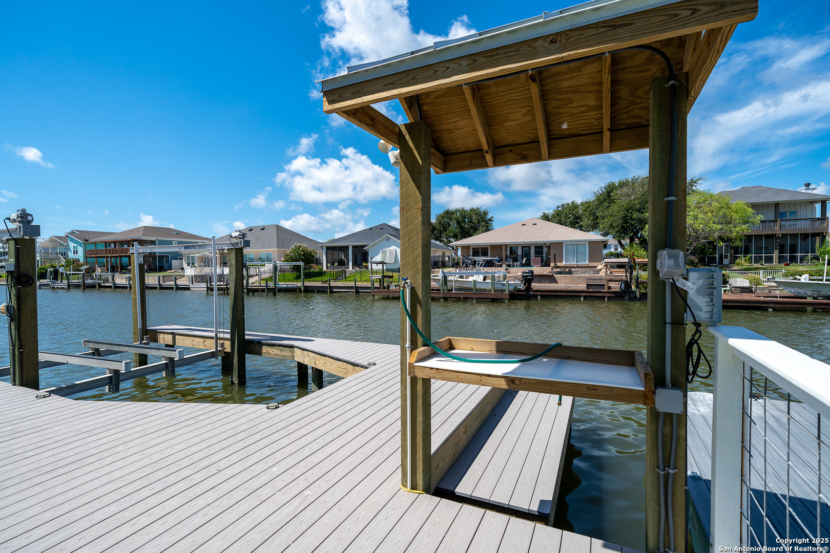107 Windjammer Road Rockport, TX 78382 - Photo 28 of 52 a view of a balcony with chairs and wooden floor
