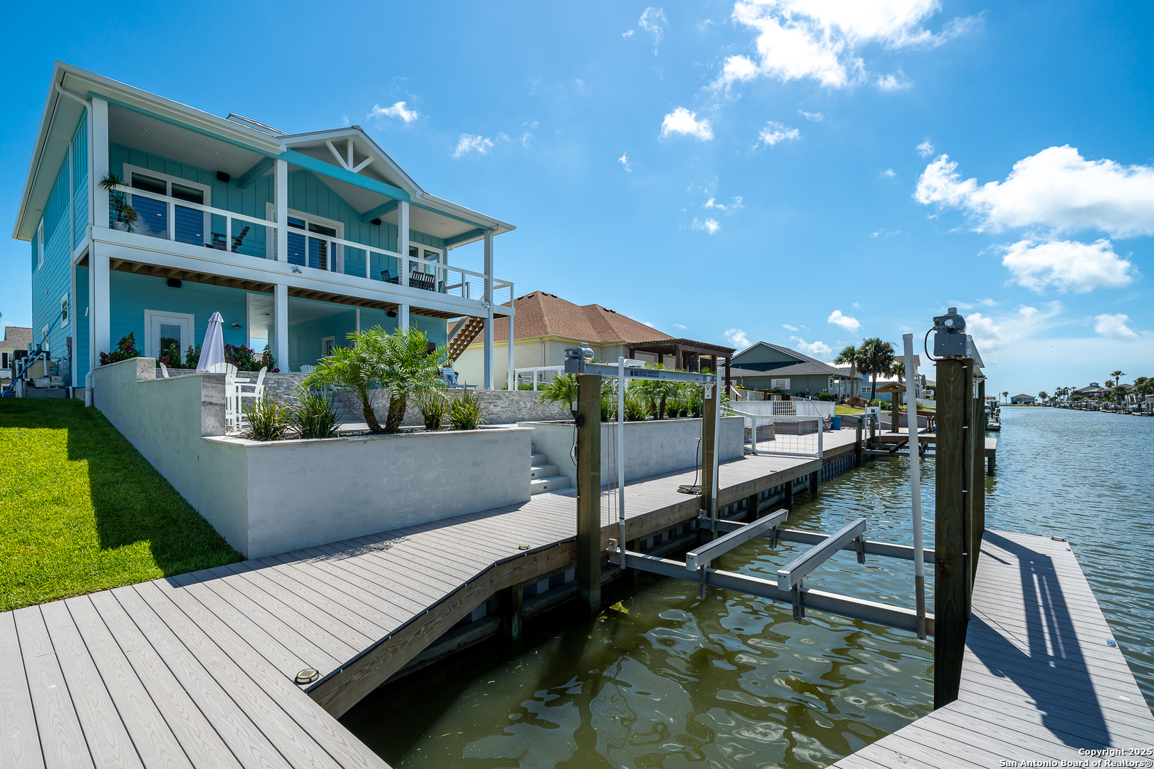 107 Windjammer Road Rockport, TX 78382 - Photo 29 of 52 a view of balcony with two chairs and a potted plant