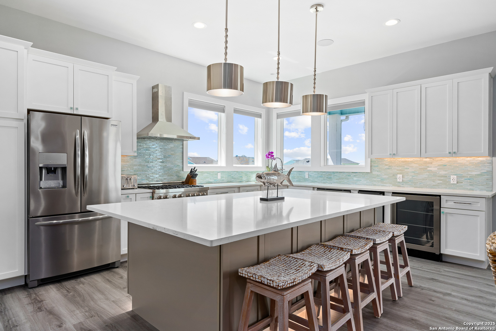 107 Windjammer Road Rockport, TX 78382 - Photo 3 of 52 a kitchen with kitchen island a center island and stainless steel appliances