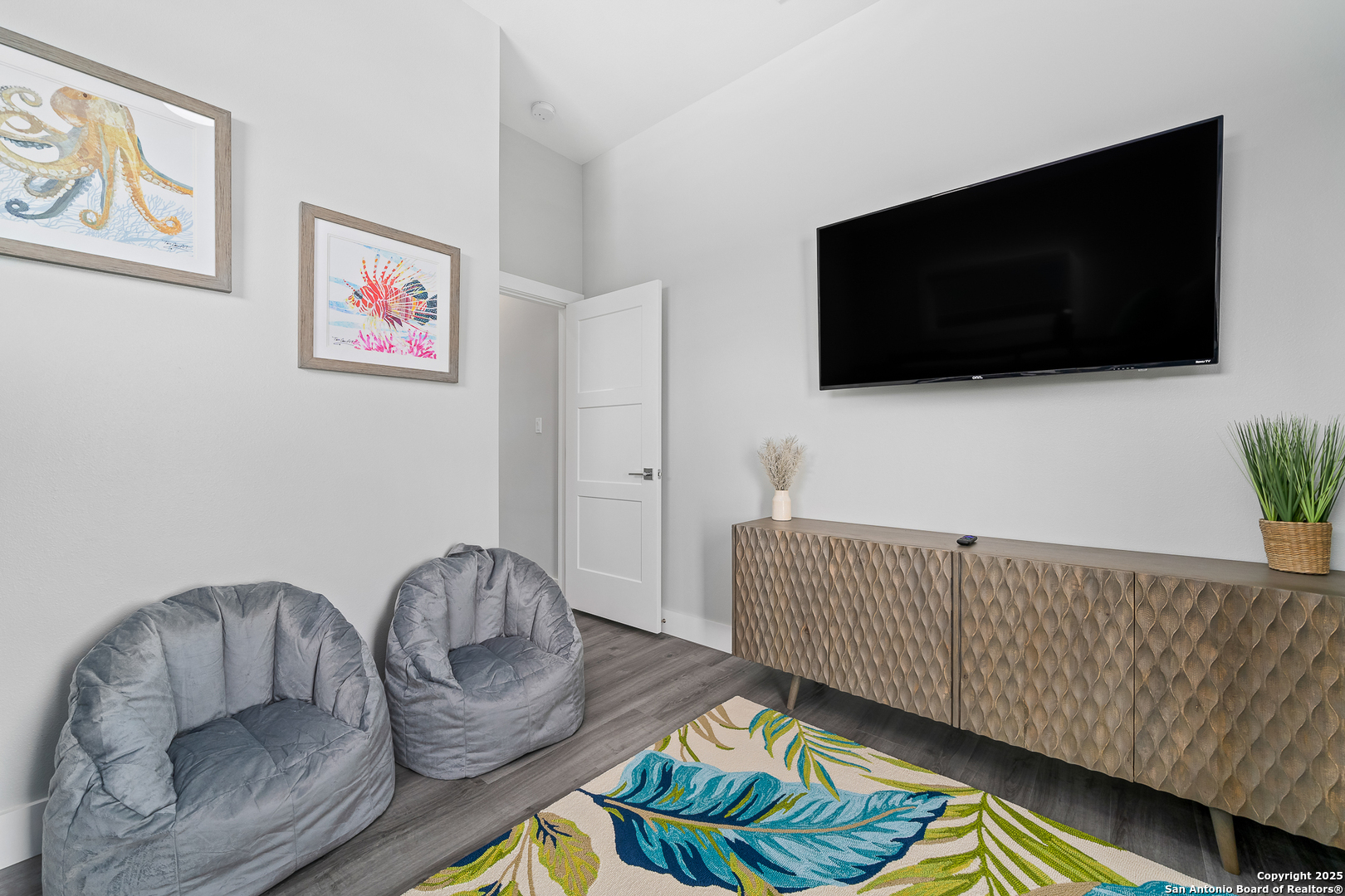 107 Windjammer Road Rockport, TX 78382 - Photo 36 of 52 a living room with furniture and a flat screen tv