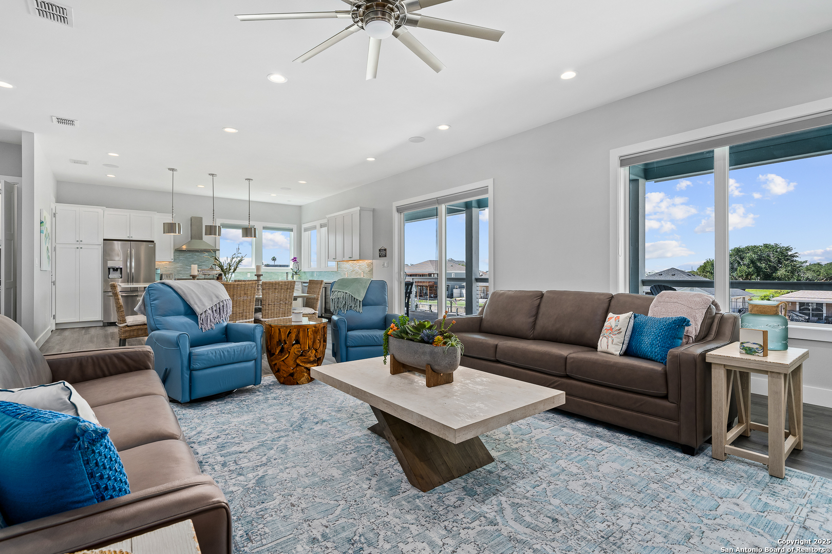 107 Windjammer Road Rockport, TX 78382 - Photo 39 of 52 a living room with furniture kitchen view and a chandelier