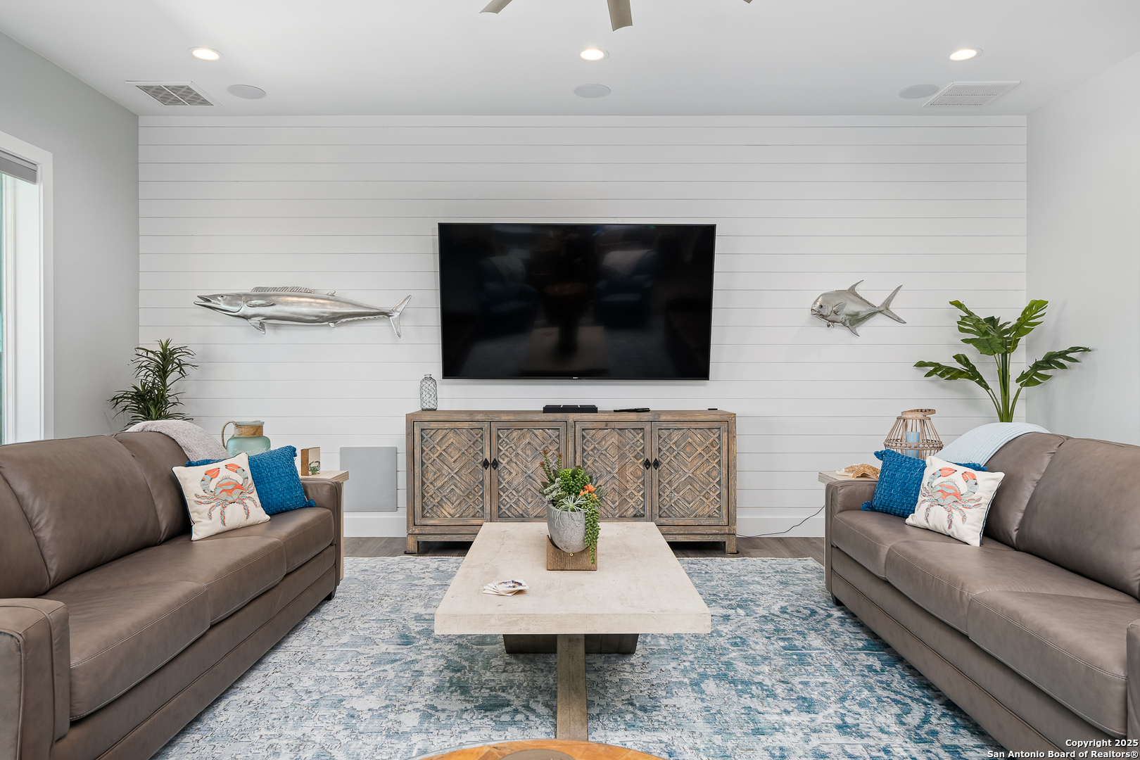 107 Windjammer Road Rockport, TX 78382 - Photo 40 of 52 a living room with furniture and a flat screen tv