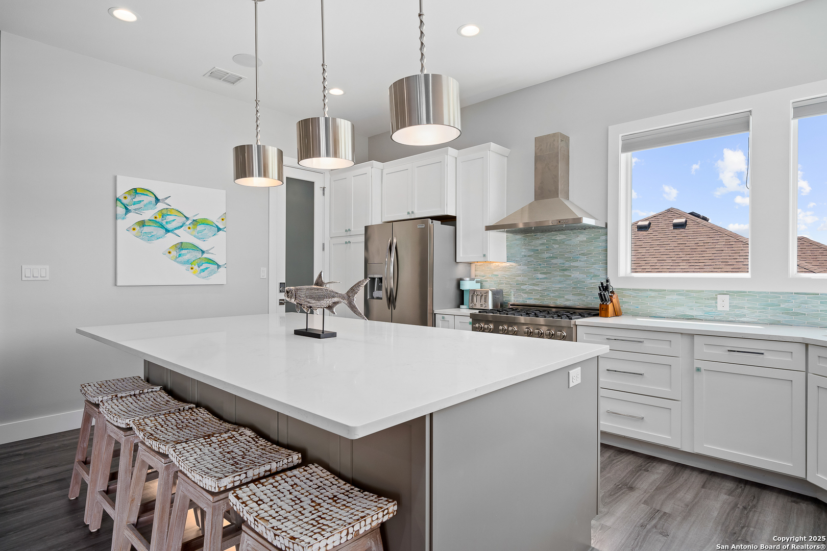 107 Windjammer Road Rockport, TX 78382 - Photo 4 of 52 a kitchen with stainless steel appliances a sink stove and wooden floor