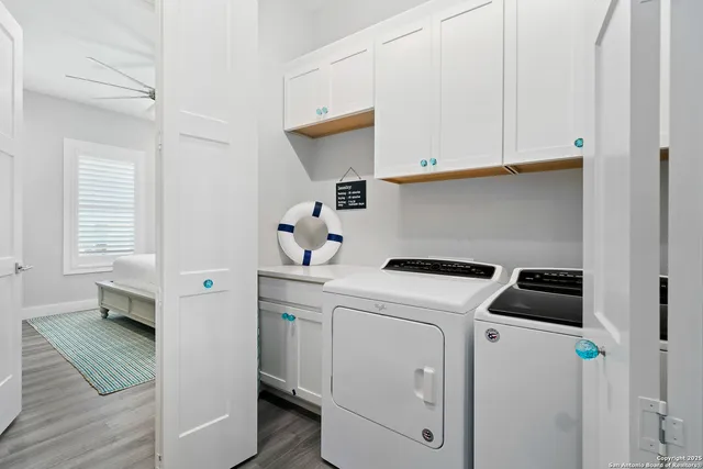 a view of living room with a floor to ceiling window and wooden floor