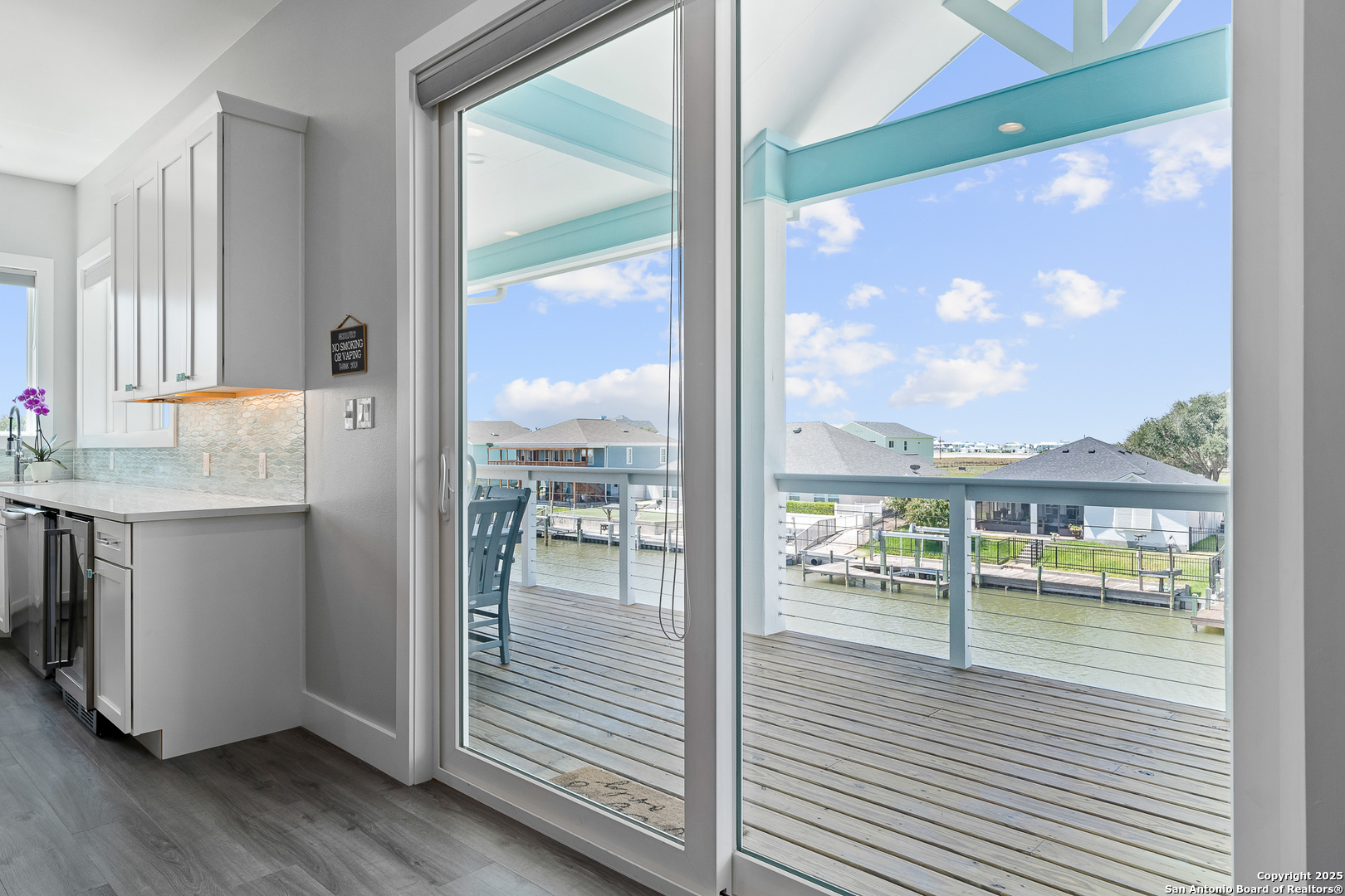 107 Windjammer Road Rockport, TX 78382 - Photo 44 of 52 a view of living room with a floor to ceiling window and wooden floor