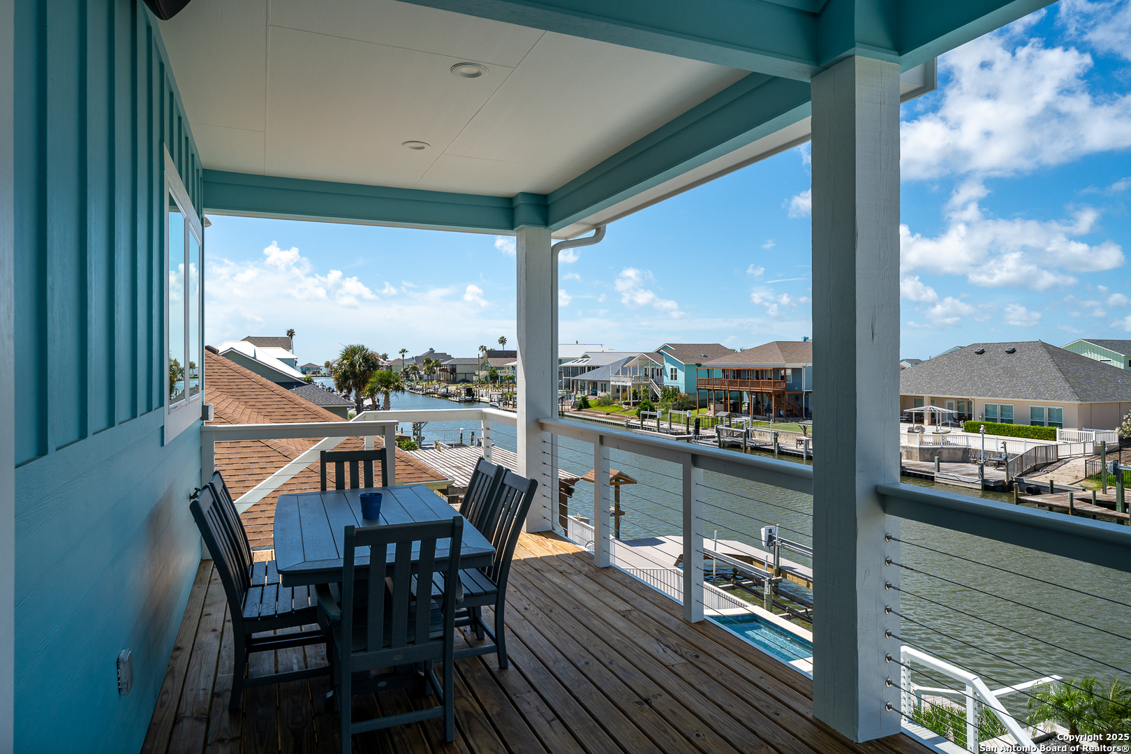 107 Windjammer Road Rockport, TX 78382 - Photo 46 of 52 a view of a balcony with table and chairs