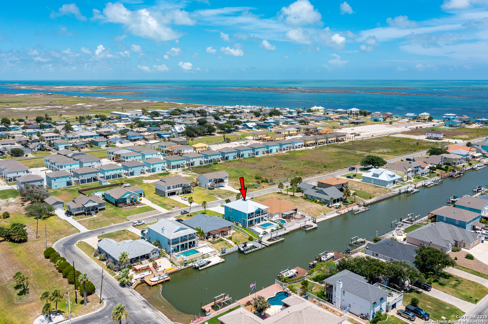 107 Windjammer Road Rockport, TX 78382 - Photo 50 of 52 an aerial view of ocean and residential houses with outdoor space