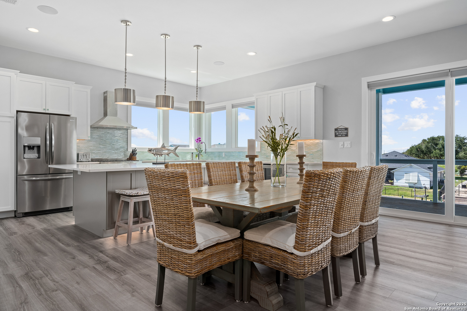 107 Windjammer Road Rockport, TX 78382 - Photo 5 of 52 a dining room with furniture a window and kitchen view