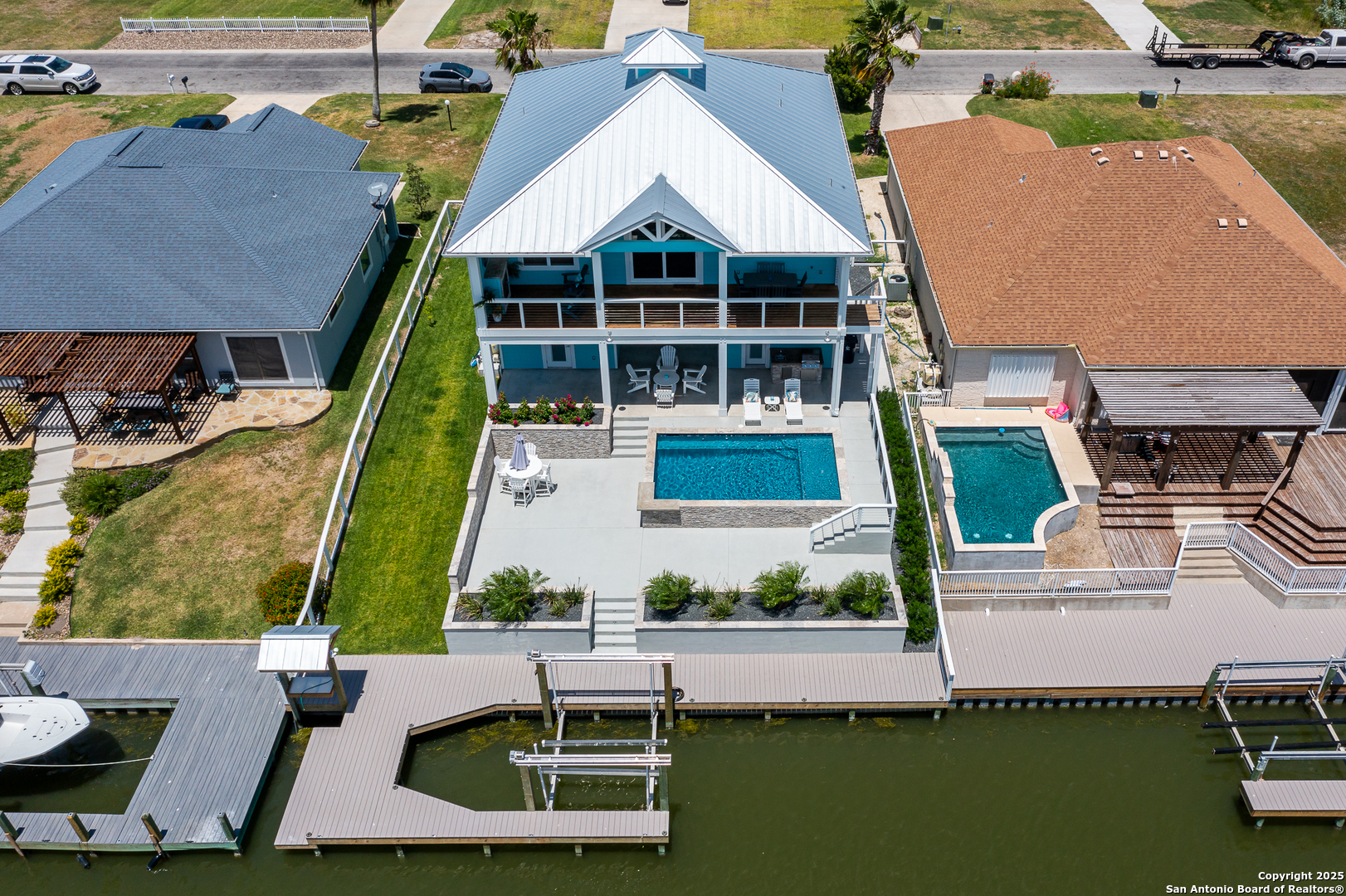 107 Windjammer Road Rockport, TX 78382 - Photo 52 of 52 an aerial view of a house with a garden and lake view
