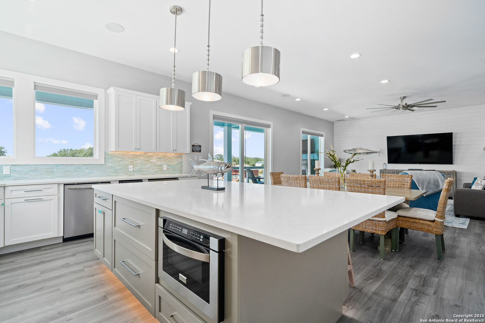 107 Windjammer Road Rockport, TX 78382 - Photo 8 of 52 a large kitchen with a table and chairs in it